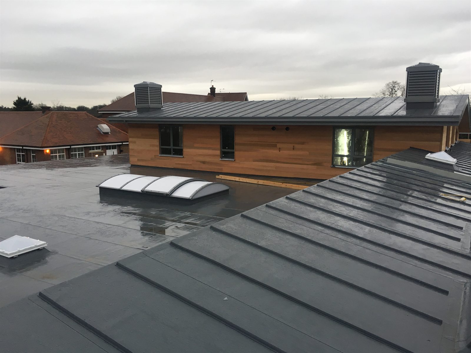 Completed mixed roofing project by Ascot Roofing
