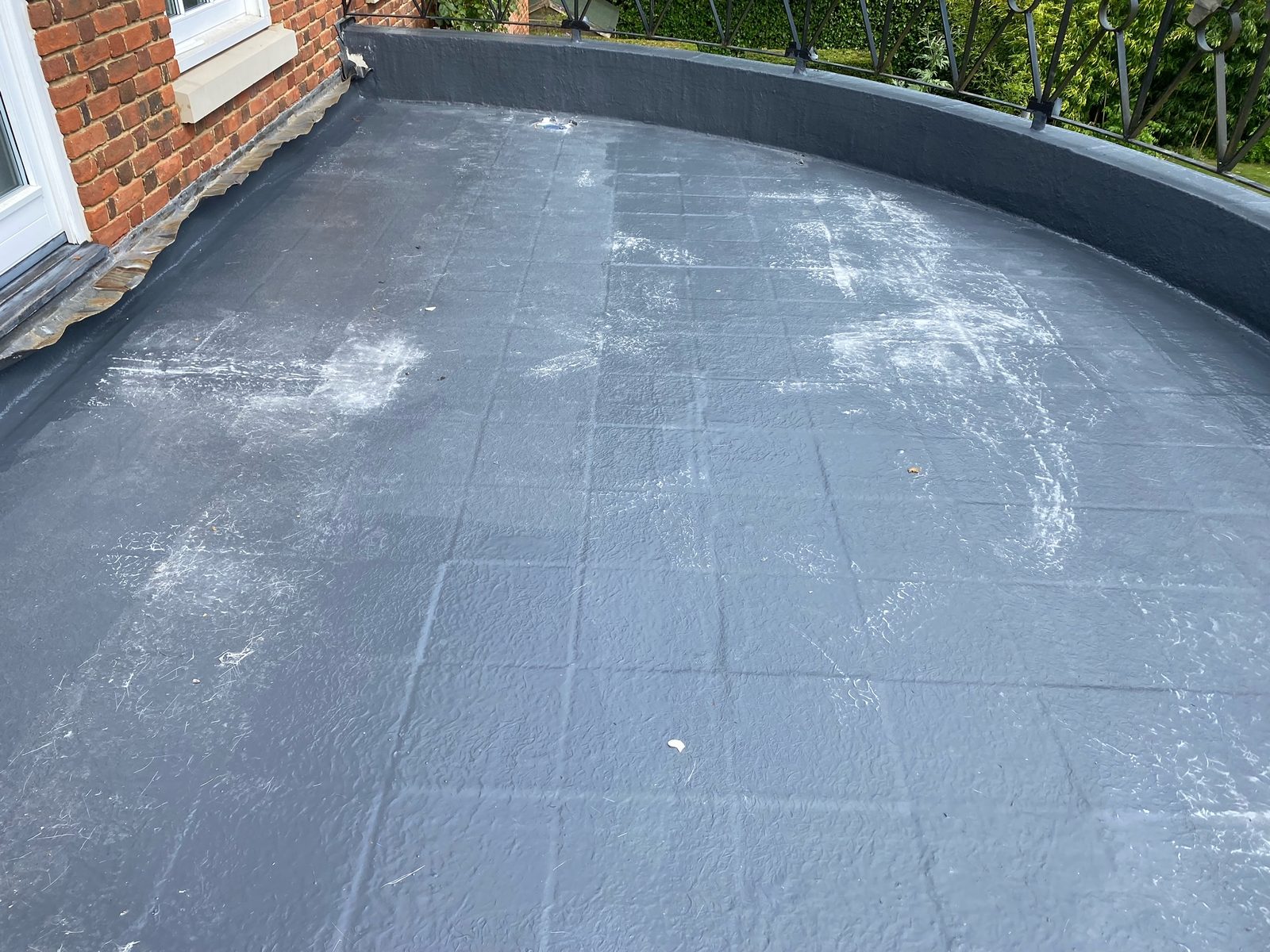 Completed liquid waterproofing on a balcony