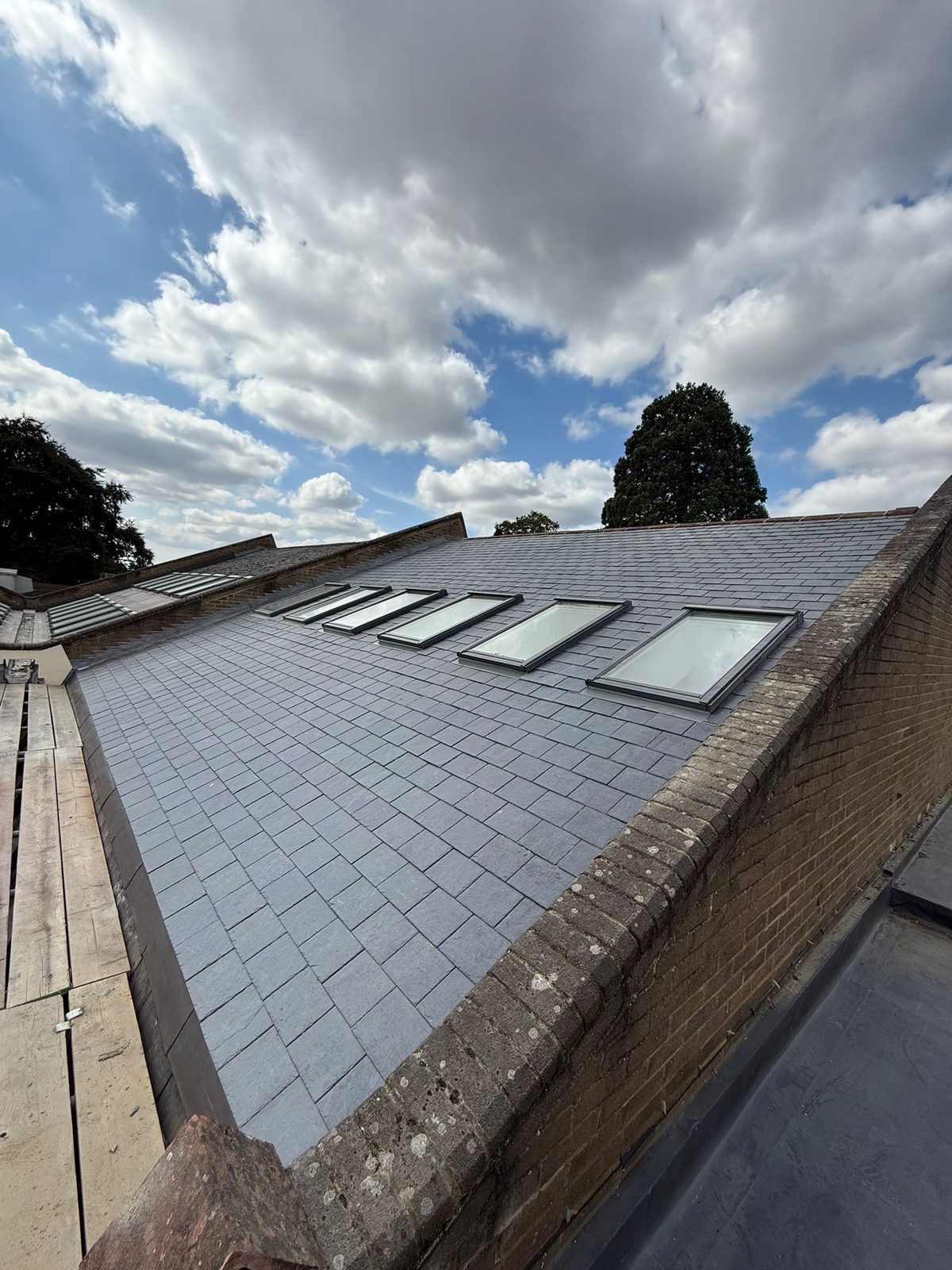 Completed pitched tiled roof with roof windows